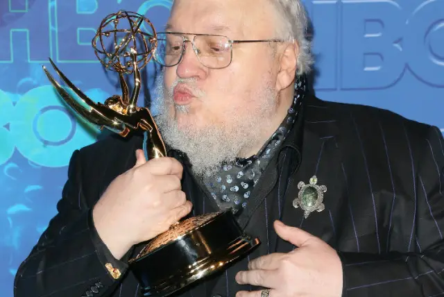 Martin, seen here winning an Emmy for the show in 2016, is too busy to watch GoT